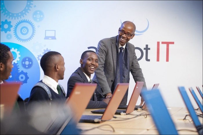 Adapt IT CEO, Sbu Shabalala interacts with Rusthof Secondary School students at the opening of the Adapt IT Knowledge Centre at an event held on 29 July